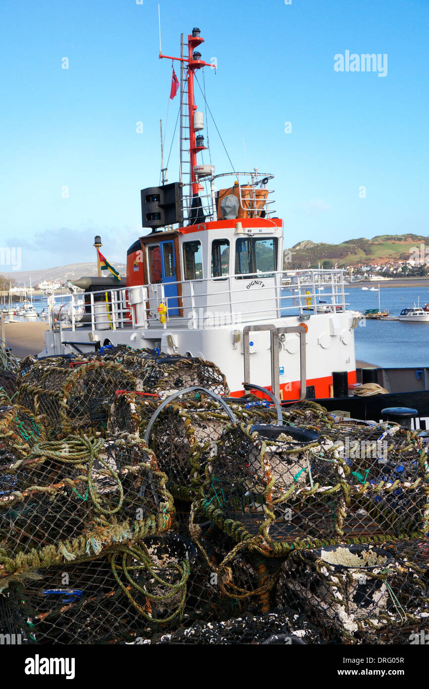 Lobster pots used for commercial fishing on the harbourside at Conwy, North Wales. Stock Photo