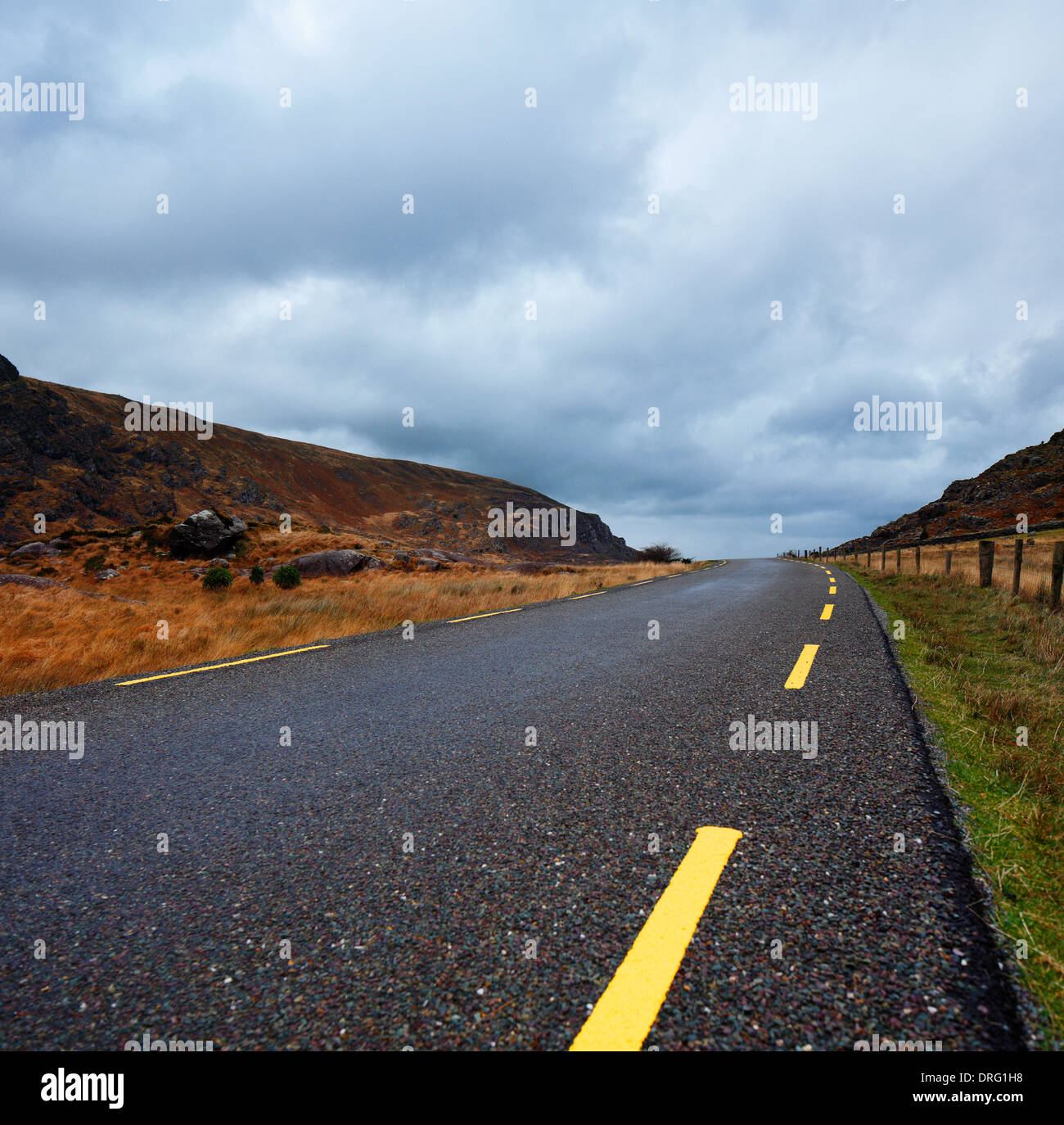 A narrow curvy road in the scenic Gap of Dunloe of County Kerry, Ireland Stock Photo