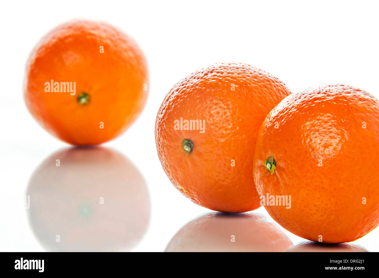 Image of three orange mandarines on white background Stock Photo Alamy