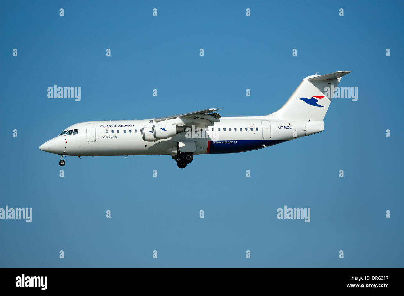 Plane on blue sky Stock Photo - Alamy