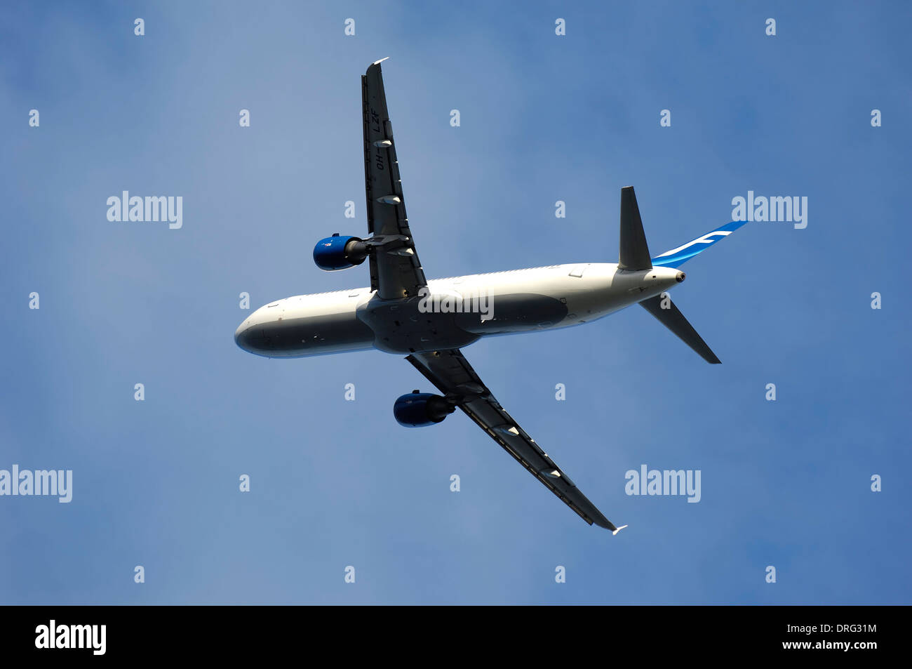 Plane on blue sky is taking off Stock Photo - Alamy