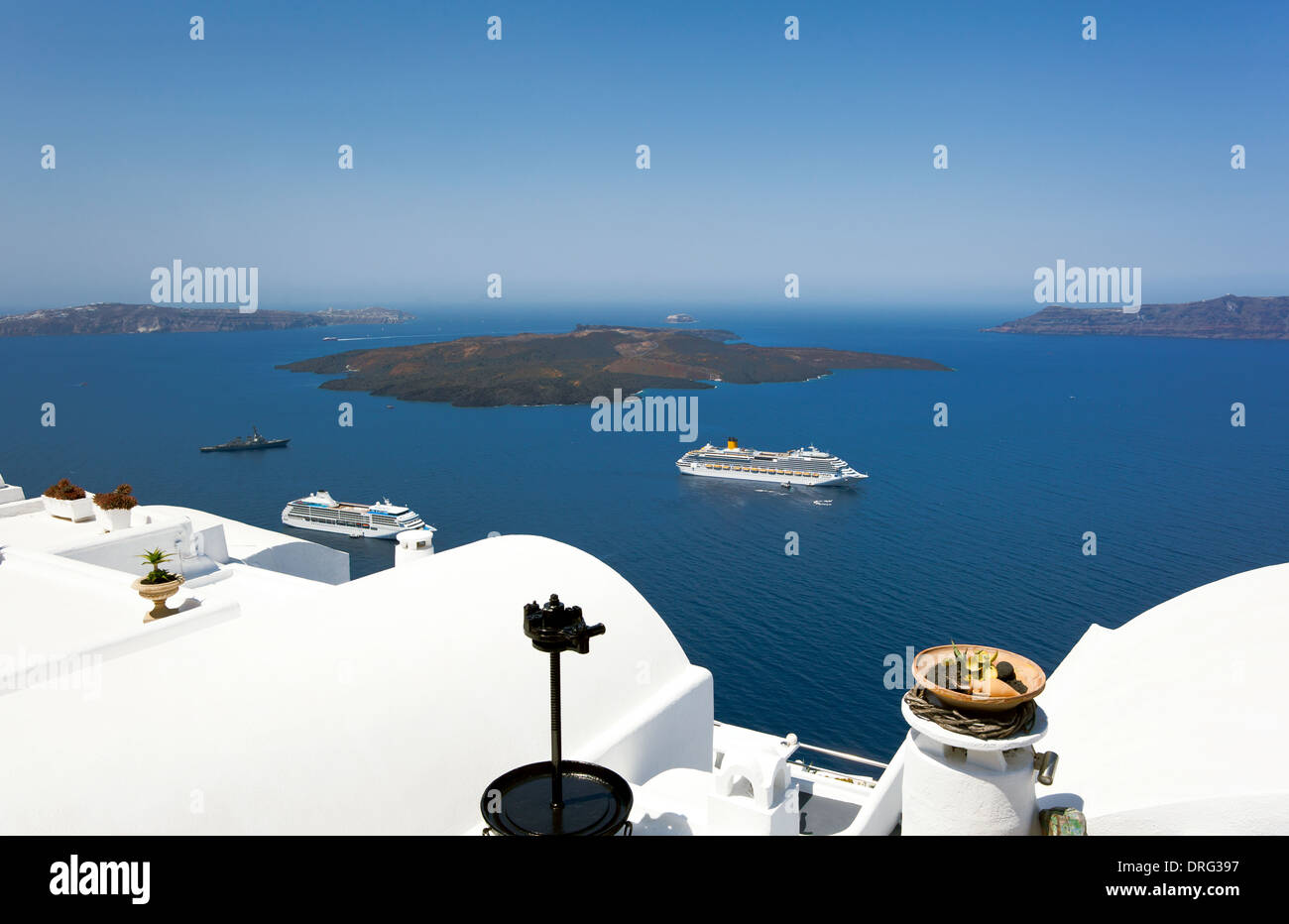 cruise ship near volcano on island of Santorini, Greece. Stock Photo