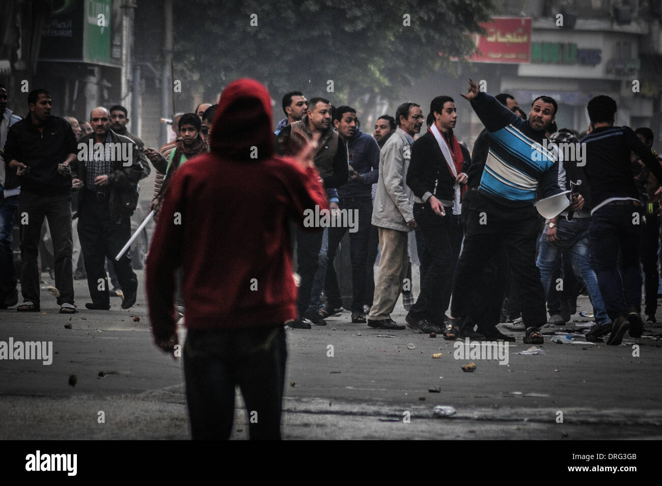 Cairo, Egypt. 25th Jan, 2014. Egyptian riot police have fired tear gas ...