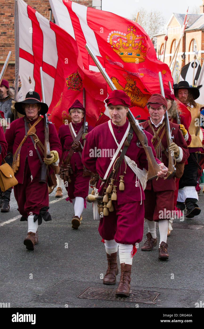Nantwich, Cheshire, UK 25th January, 2014. Town parade at Holly Holy Day & Siege of Nantwich re-enactment.  For over 40 years the faithful troops of The Sealed Knot have gathered in the historic town for a spectacular re-enactment of the bloody battle that took place almost 400 years ago and marked the end of the long and painful siege of the town.  Roundheads, cavaliers, and other historic entertainers converged upon the town centre to re-enact the Battle. The siege in January 1644 was one of the key conflicts of the English Civil War. Credit:  Conrad Elias/Alamy Live News Stock Photo
