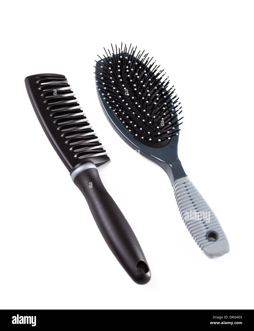 Black hairbrush and comb isolated on white Stock Photo