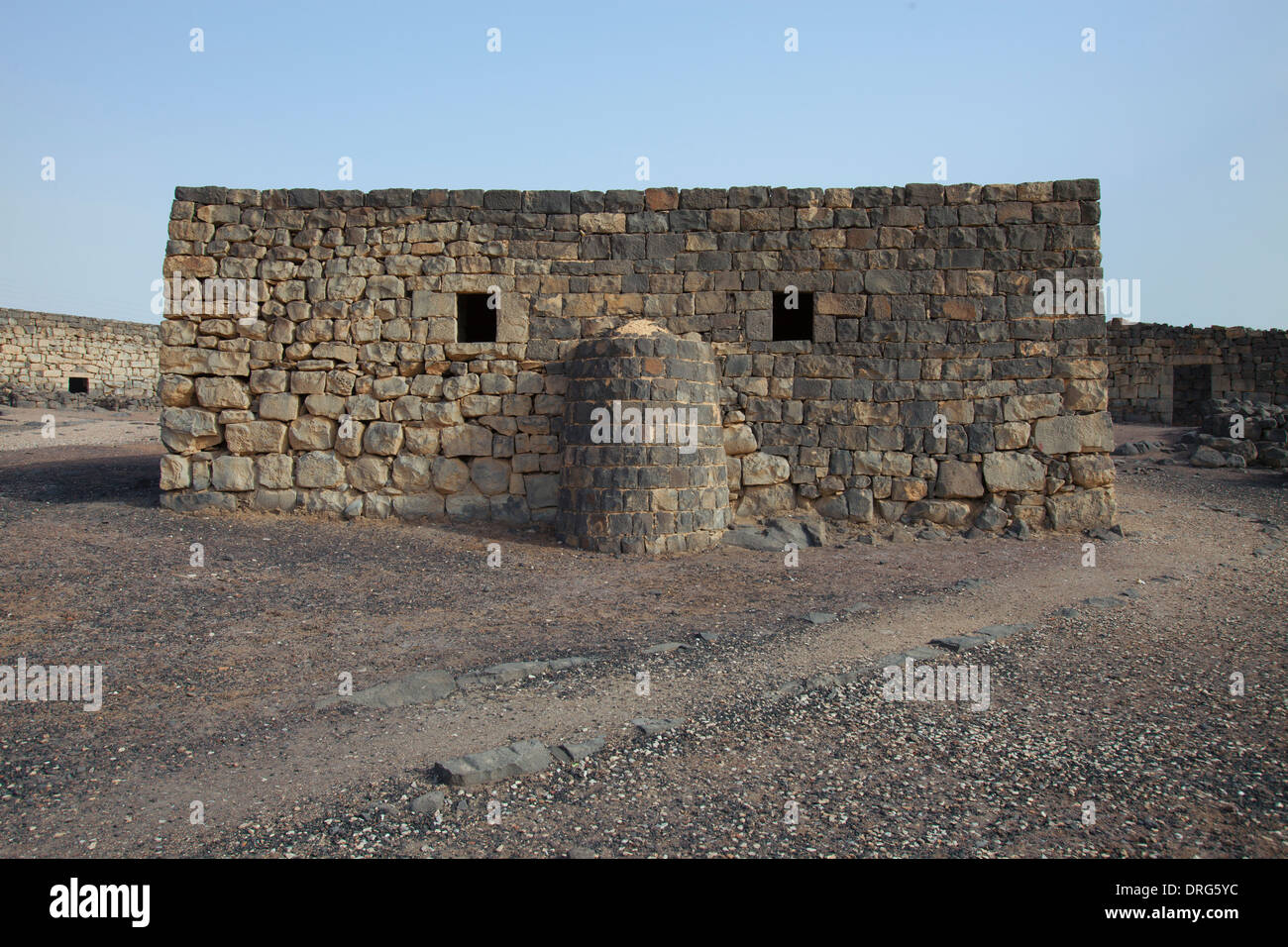 Ruins of Qasr al-Azraq built by the Ayyubids in the 13th century using locally quarried basalt located in the province of Zarqa Governorate in central-eastern Jordan Stock Photo