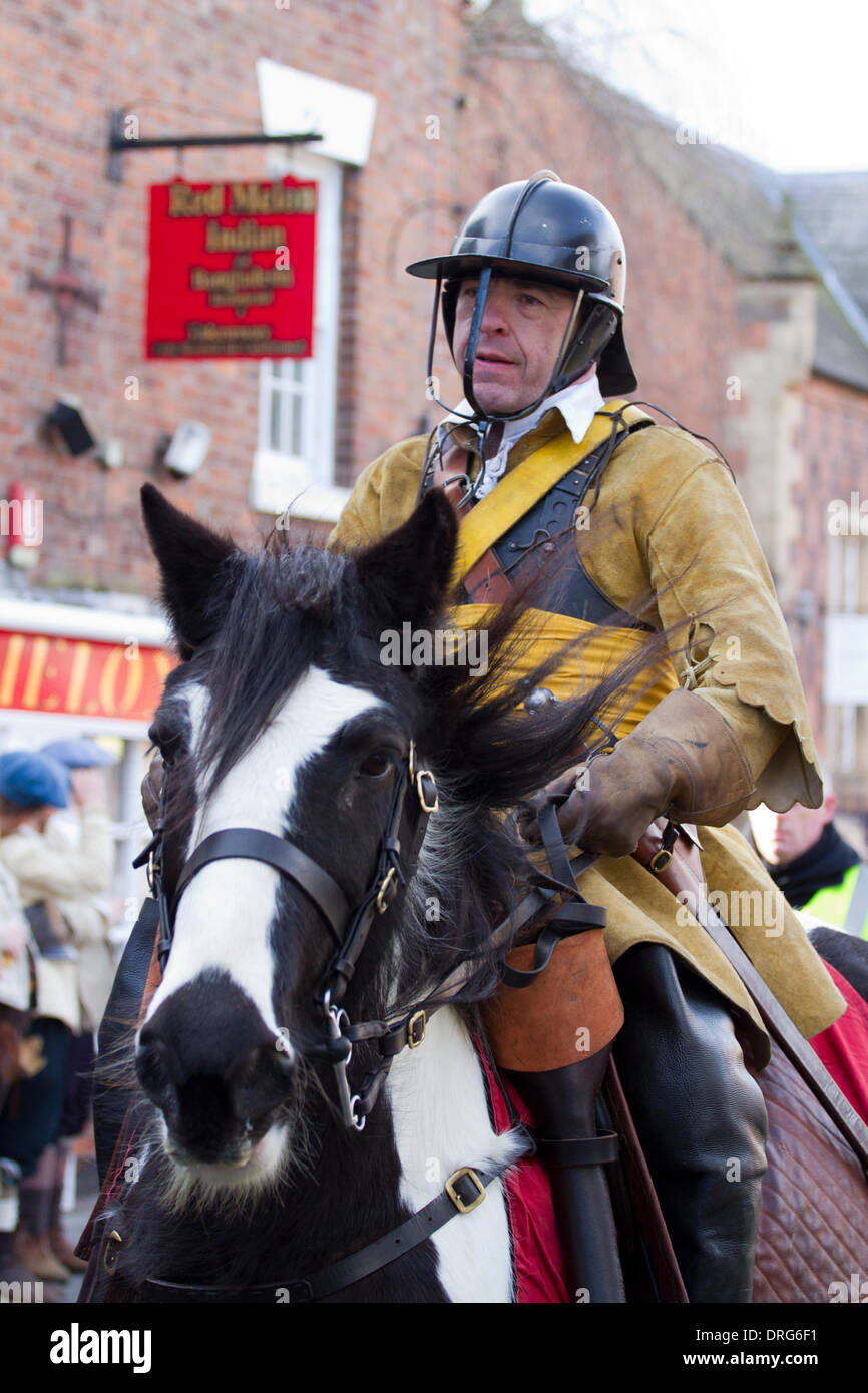 Nantwich, Cheshire, UK 25th January, 2014. Mounted Roundhead at Holly Holy Day & Siege of Nantwich re-enactment. For over 40 years the faithful troops of The Sealed Knot have gathered in the historic town for a spectacular re-enactment of the bloody battle that took place almost 400 years ago and marked the end of the long and painful siege of the town. Roundheads, cavaliers, and other historic entertainers converged upon the town centre to re-enact the Battle. The siege in January 1644 was one of the key conflicts of the English Civil War. Credit:  Conrad Elias/Alamy Live News Stock Photo