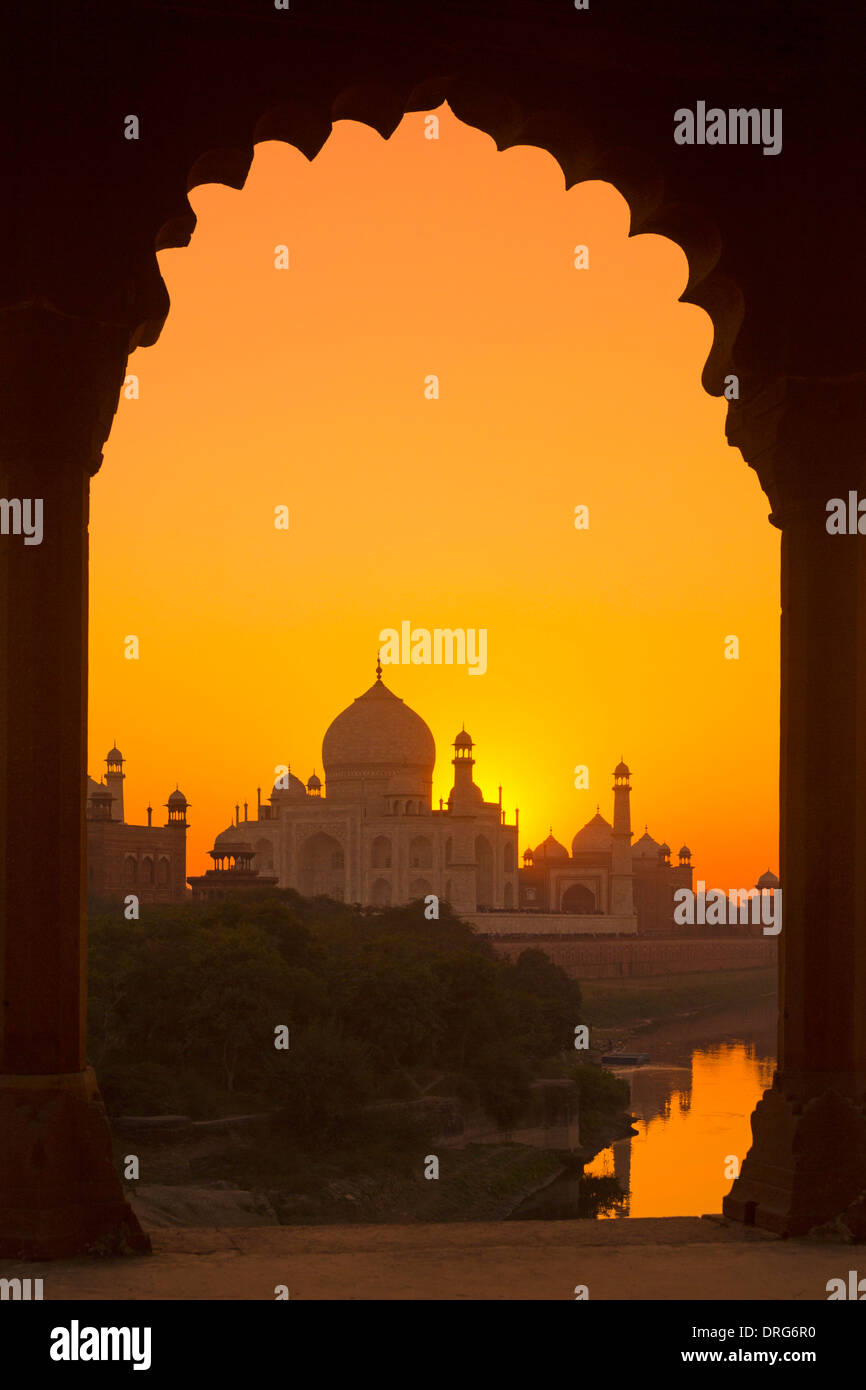 India, Uttar Pradesh, Taj Mahal framed by an arch at sunset Stock Photo