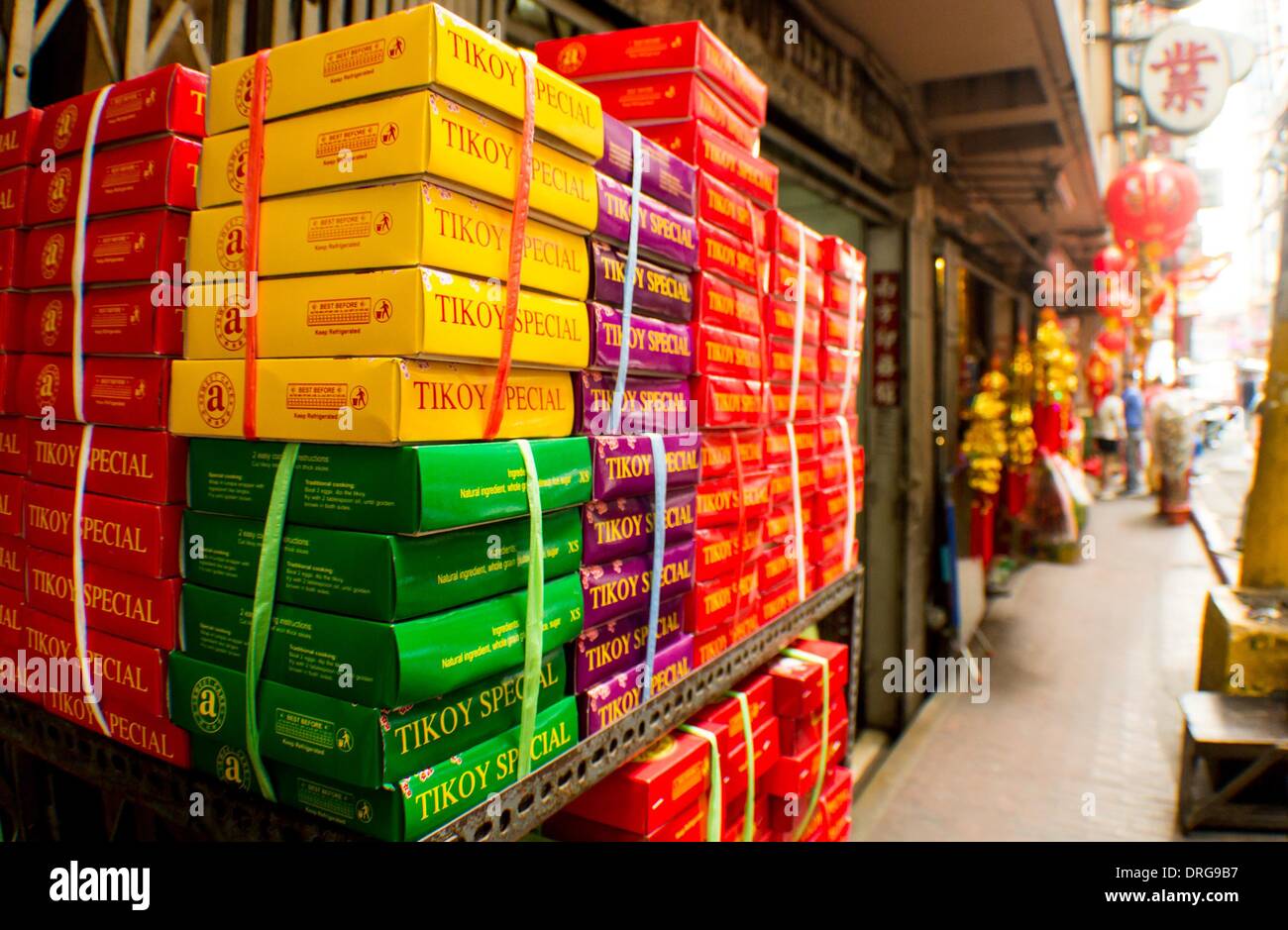 Manila, The Philippines. 25th Jan, 2014. Assorted colored box of sweet rice cakes or ''Tikoy'' in the Street of Ongpin. A week before the annual celebration the Filipino-Chinese community prepares to welcome the Lunar New Year in Manila's Chinatown district, Binondo. Chinatown in Manila, considered to be the world's  oldest Chinatowns outside China. Credit:  Herman R. Lumanog/NurPhoto/ZUMAPRESS.com/Alamy Live News Stock Photo