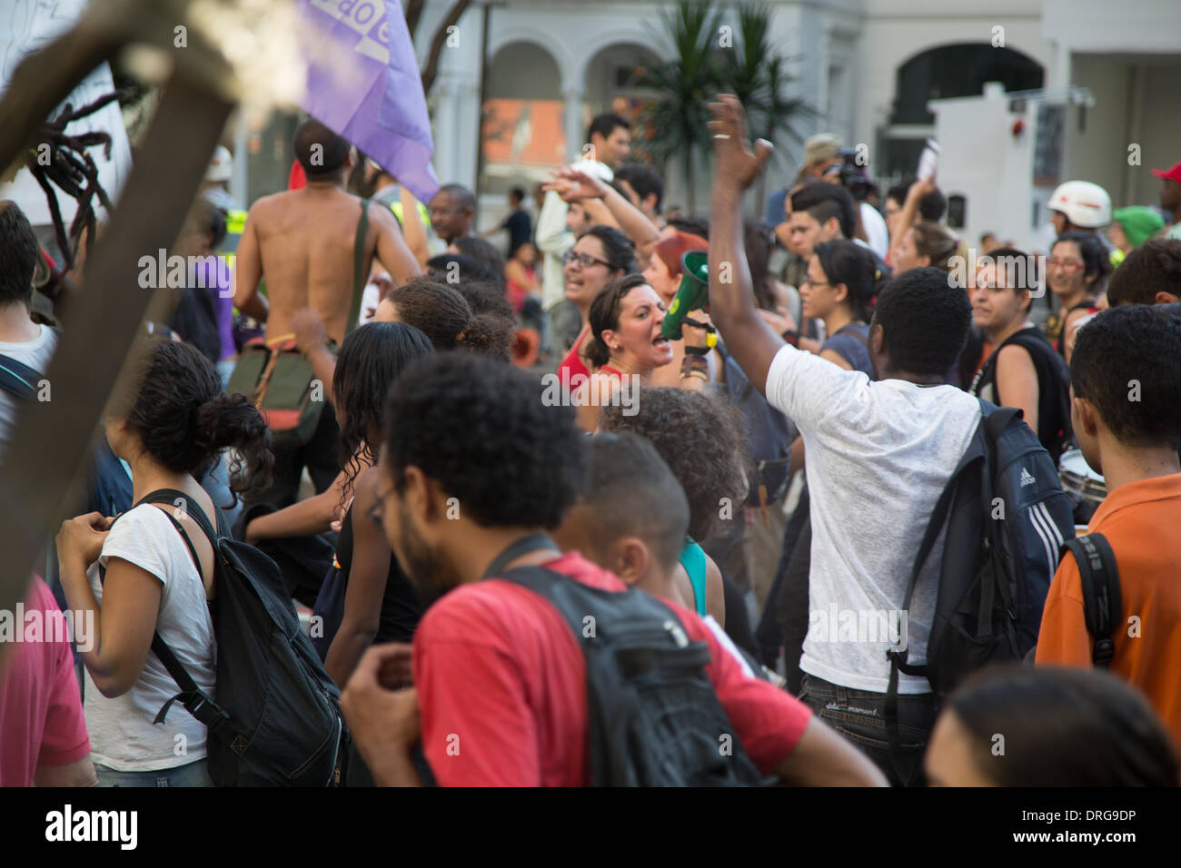 Sao Paulo, Brazil. 25th Jan, 2014. Protesters carry signs and shout slogans during a rally at Paulista Avenue in Sao Paulo against the World Cup in Brazil. People took to the street to complain about the costs of staging the World Cup in Brazil.  Credit:  Andre M. Chang/Alamy Live News Stock Photo