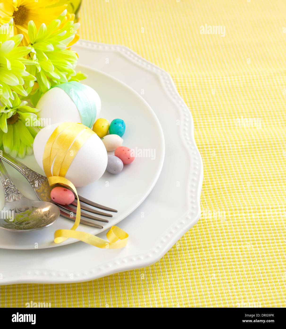 Easter table setting with flowers and eggs Stock Photo