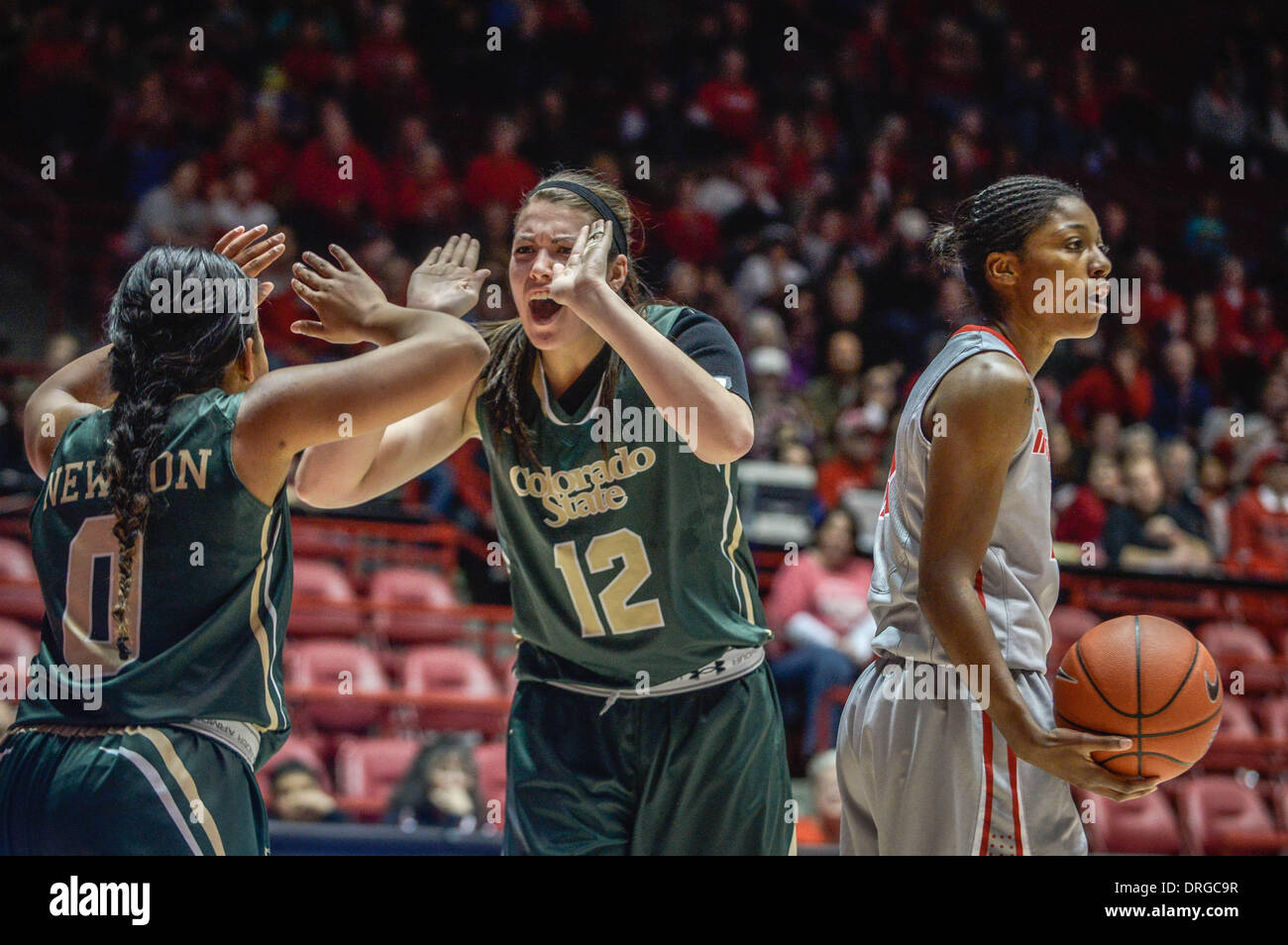 Albuquerque, New Mexico, USA. 25th Jan, 2014. Roberto E. Rosales.Lobo Antiesha Brown(Cq), right, can't believe the call and reacts in disbelief as Colorado State players AJ Newton(Cq), left and Sam Martin(Cq), middle, high five each other. The Lobo women had chance to put the game away late in the second half but couldn't. Shumpert led the Lobos in scoring with 14 points. Roberto E. Rosales/Albuquerque Journal.Albuquerque, New Mexico. © Roberto E. Rosales/Albuquerque Journal/ZUMAPRESS.com/Alamy Live News Stock Photo