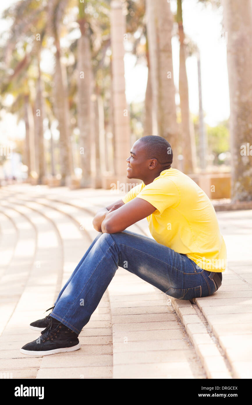 Black guy sitting hi-res stock photography and images - Alamy