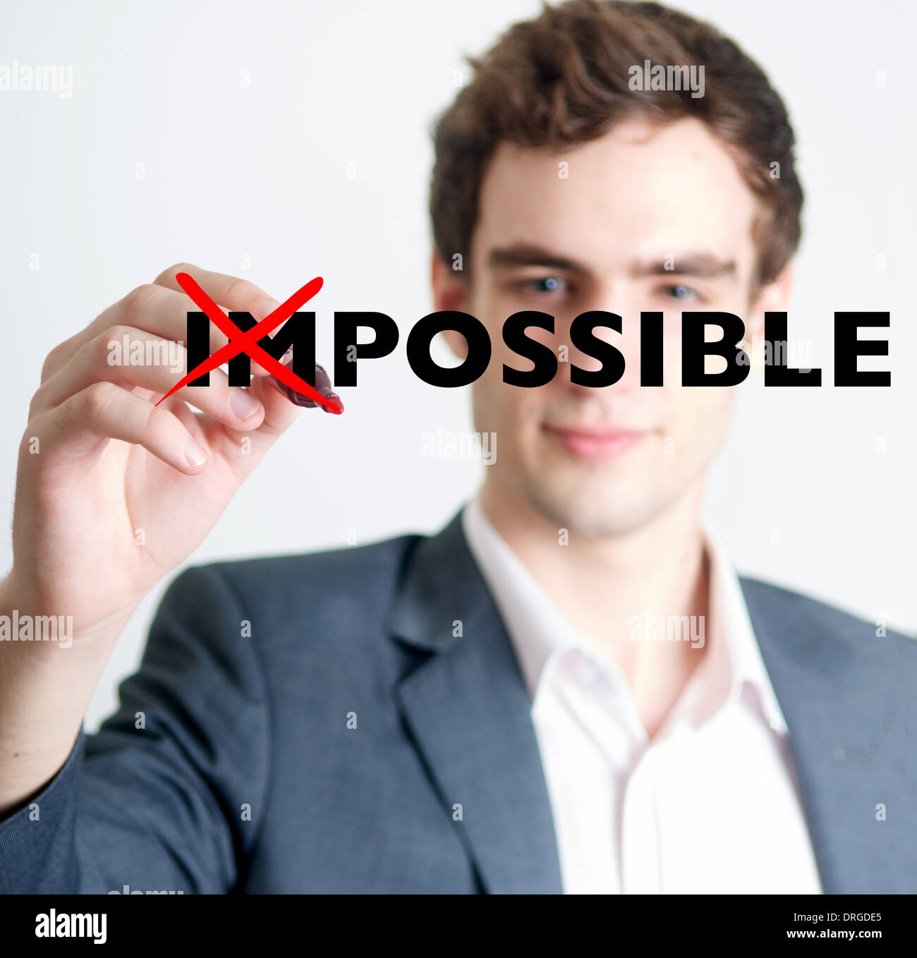 Professional young man crossing out with marker impossible concept Stock Photo