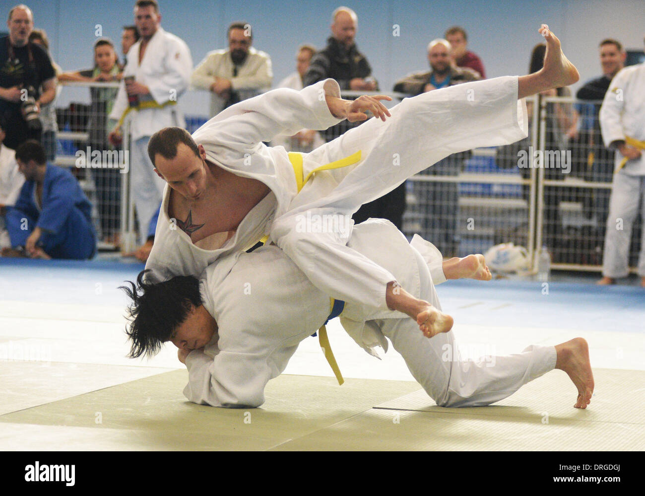 Richmond, Canada. 26th Jan, 2014. Jordan Harris of Canada (top) competes with compatriot Victor Chen at the 2014 Vancouver International Judo Tournament in Richmond, Canada, Jan. 25, 2014. © Sergei Bachlakov/Xinhua/Alamy Live News Stock Photo
