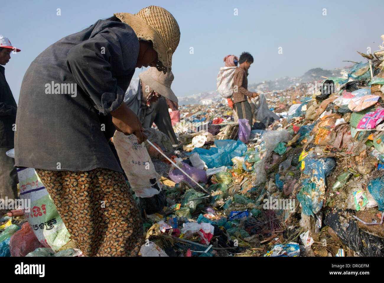 Scavengers are collecting recyclable material at the toxic and polluted Stung Meanchey Landfill in Phnom Penh, Cambodia. Stock Photo