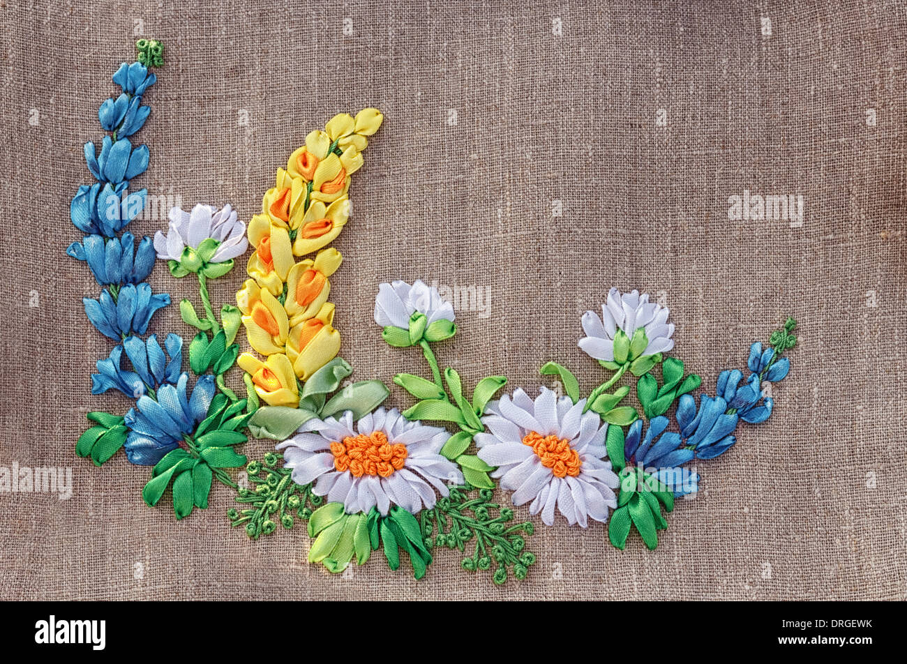 The Belarusian national embroidery tapes on linen fabric. Stock Photo
