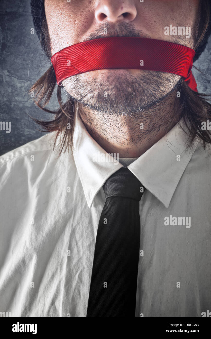 Businessman with red strip over mouth. Silence and secrecy concept. Stock Photo