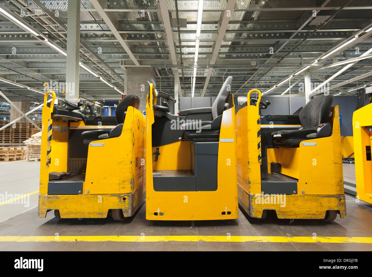Three parked forklift in an industry warehouse Stock Photo Alamy
