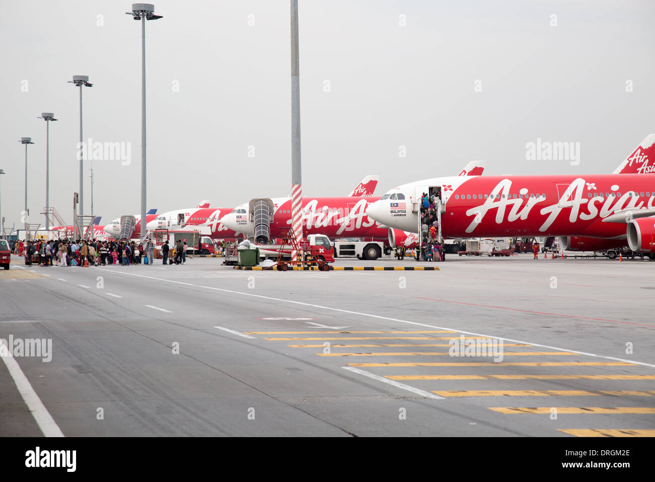 Air Asia airplanes on the runway at Kuala Lumpur Airport Stock Photo