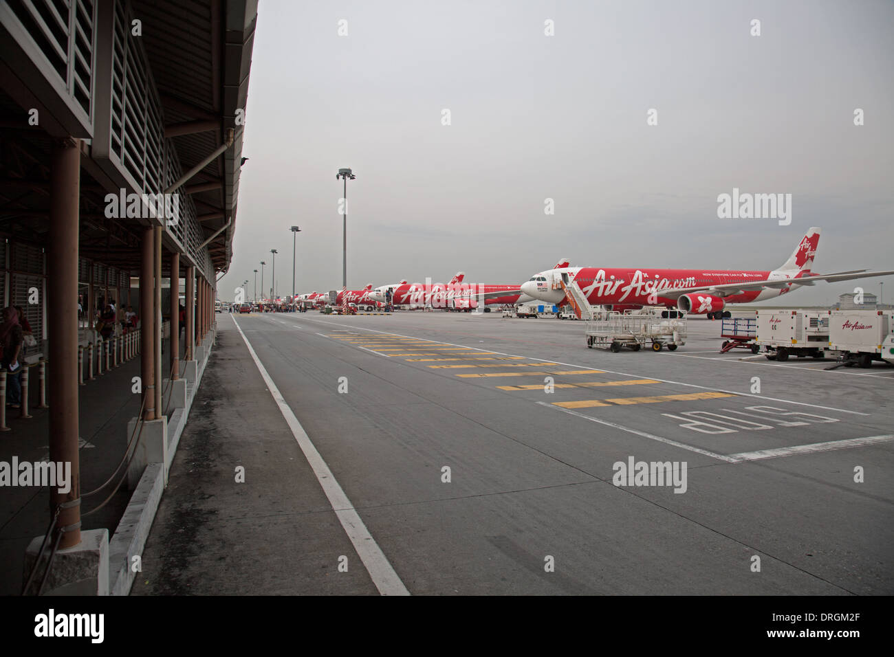 Air Asia airplanes on the runway at Kuala Lumpur Airport Stock Photo