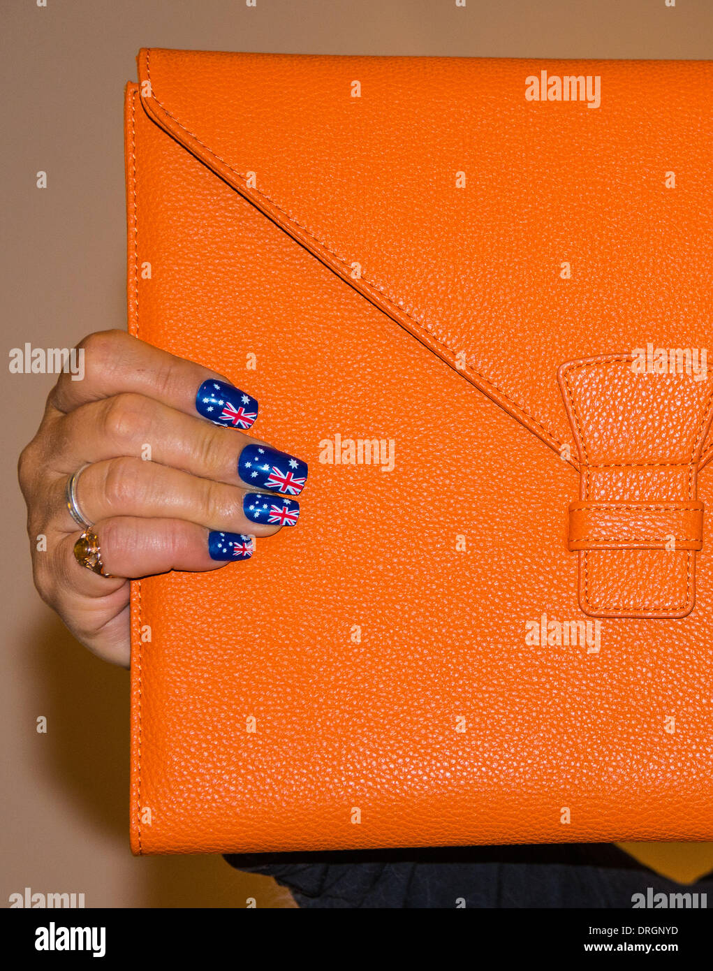 Orange brief satchel diary note pad with hands painted nails with ...
