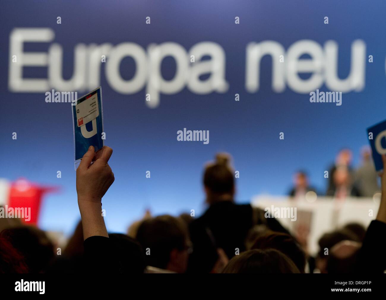 Berlin, Germany. 26th Jan, 2014. A delegate holds up her vote during a meeting of the SPD's party executive committee in Berlin, Germany, 26 January 2014. The meeting was concerned with the forthcoming extraordinary general party conference of the SPD and the conference of the SPD's European delegates. Photo: Soeren Stache/dpa/Alamy Live News Stock Photo