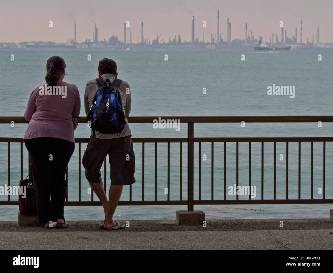 Views of oil refinery at Jurong island and harbour from Labrador nature reserve, Singapore Stock Photo