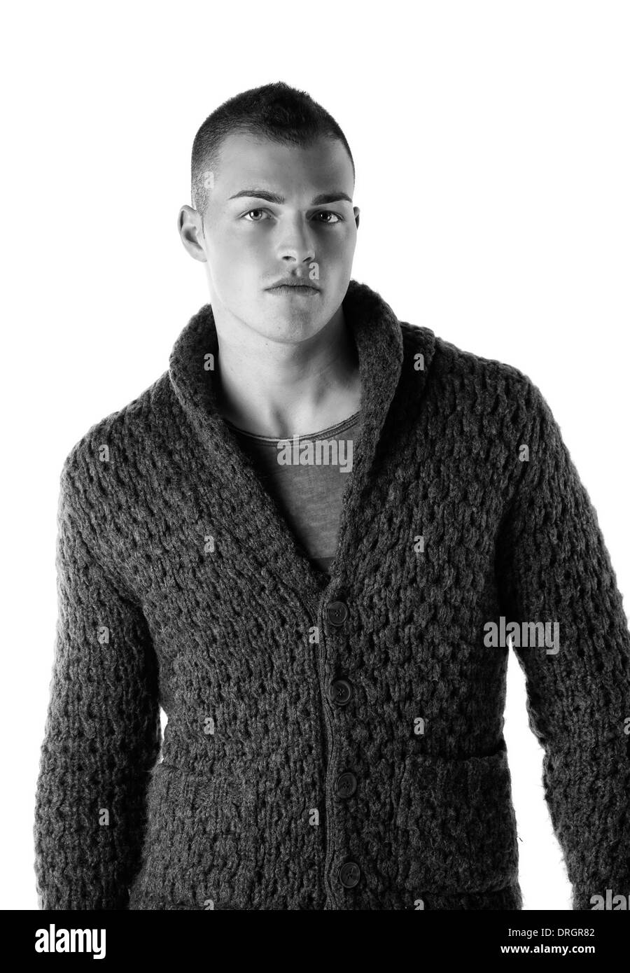 Attractive young man with wool sweater, isolated on white background Stock Photo
