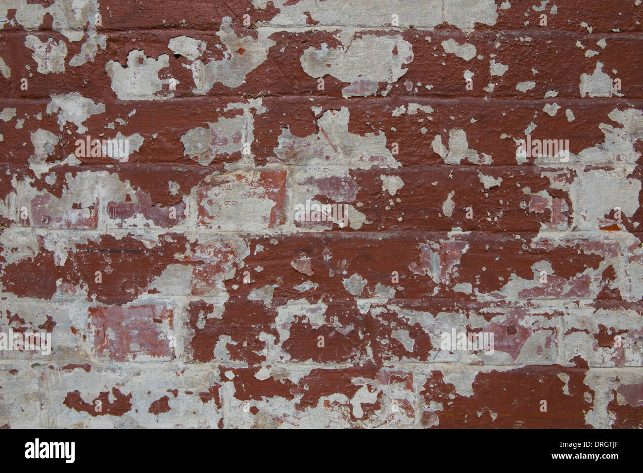 Section of brick wall covered in peeling paint Stock Photo Alamy