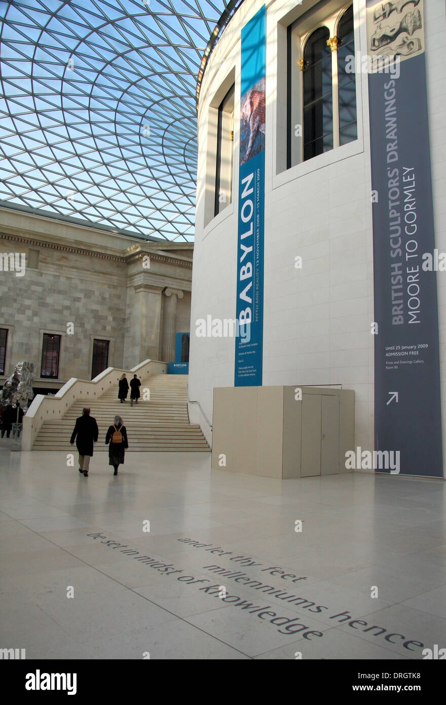 Visitors in the  'Queen Elizabeth II Great Court' with the Reading Room at its centre in the British Museum, London, England, UK Stock Photo