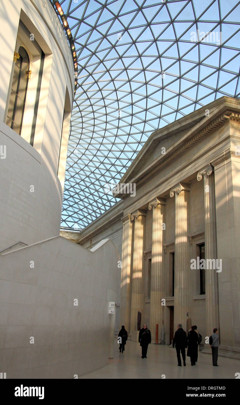 Visitors in the  'Queen Elizabeth II Great Court' with the Reading Room at its centre in the British Museum, London, England, UK Stock Photo
