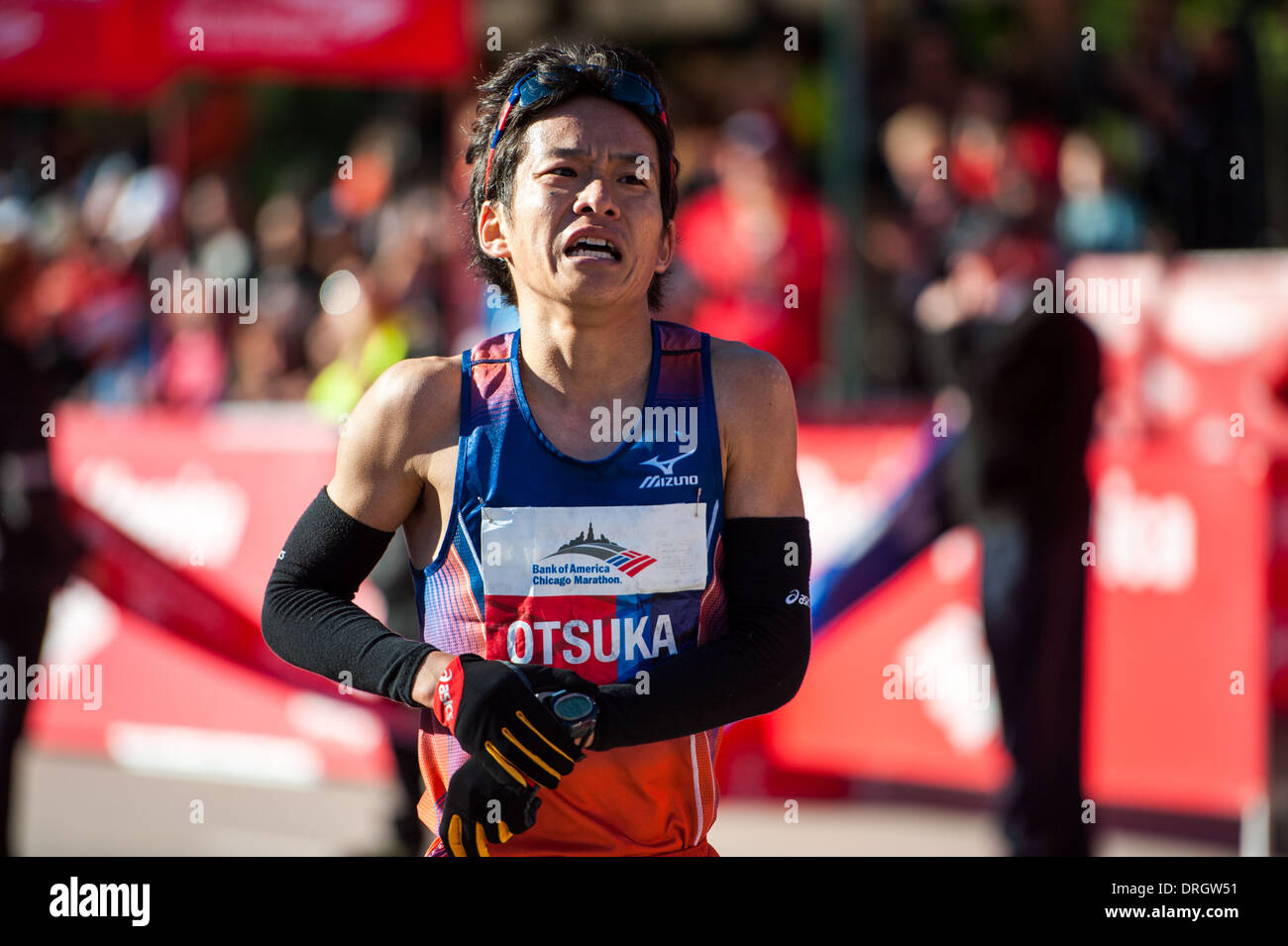 Yoshiki Otsuka crosses the finish line at the Bank of America Chicago Marathon on October 13, 2013. Stock Photo