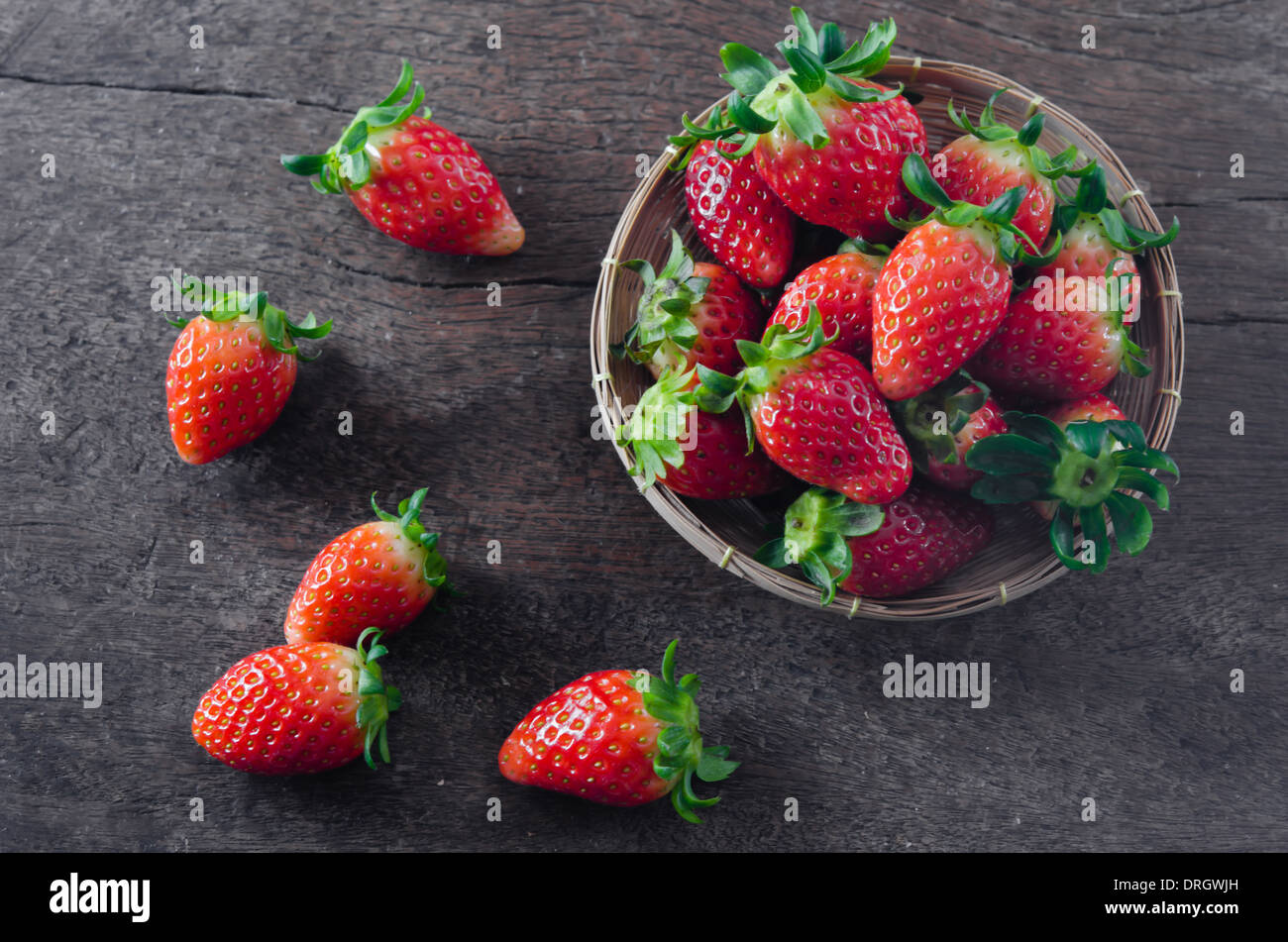 Fresh strawberries on basket , over old wooden background Stock Photo ...