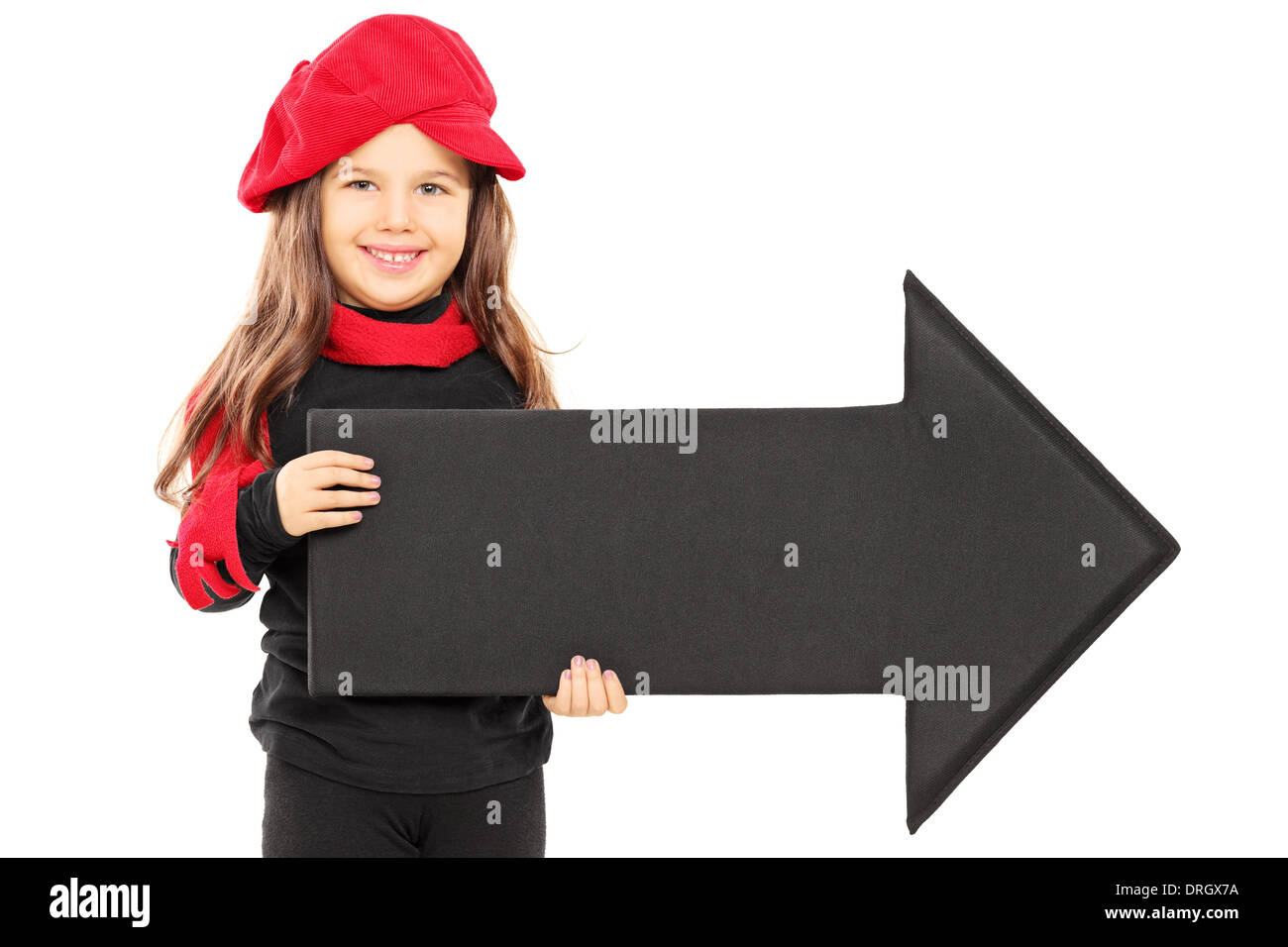 Cute little girl wearing red beret and holding big black arrow Stock Photo