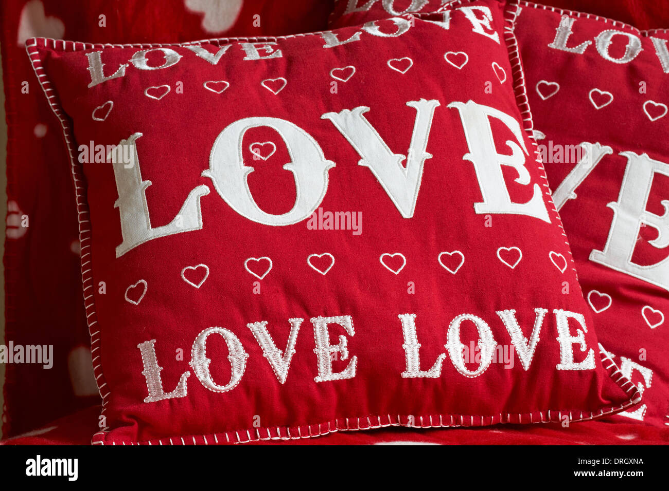 love cushions with the word love on and hearts perfect for Valentines