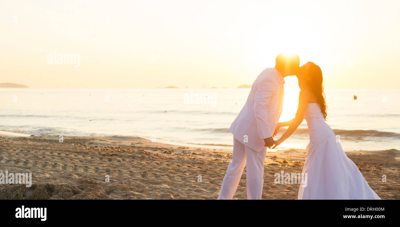 Brautpaar am Strand auf Ibiza, Spanien - bridal couple at the Beach, Ibiza, Spain Stock Photo