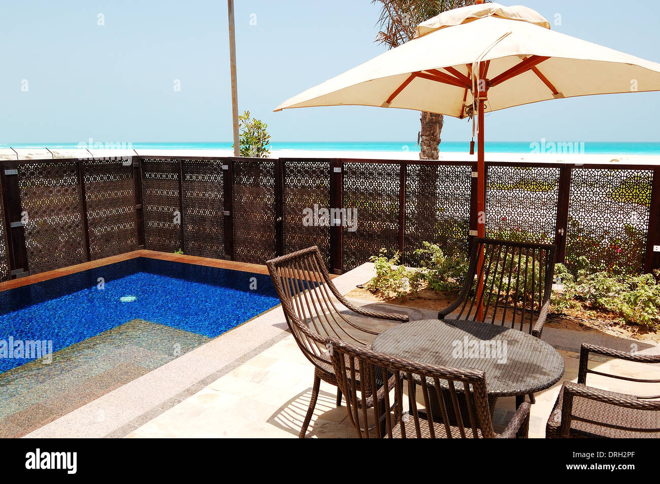 Swimming pool near beach of the luxury hotel, Saadiyat island, Abu Dhabi, UAE Stock Photo