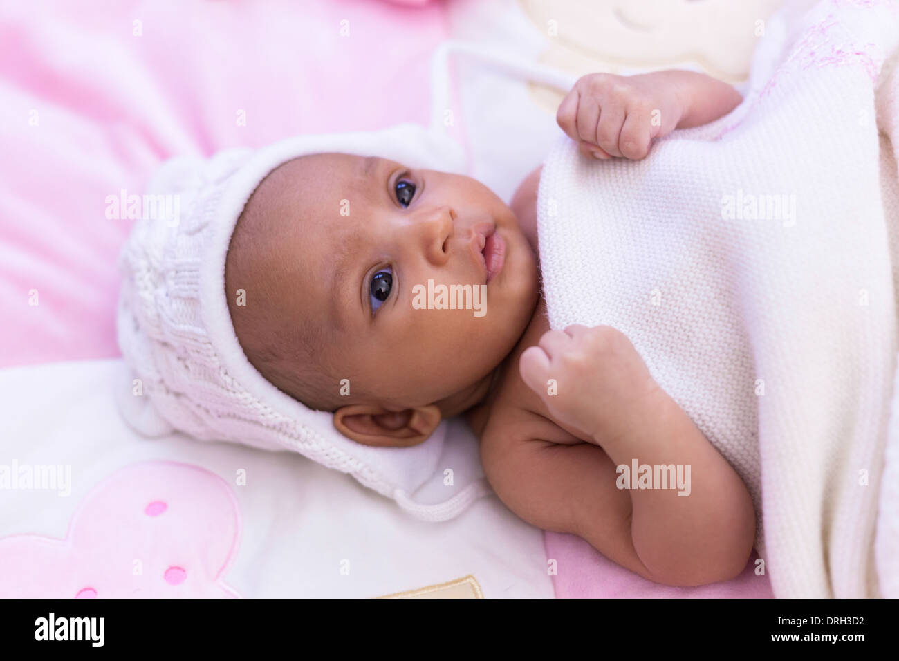 Adorable little african american baby girl looking Black people