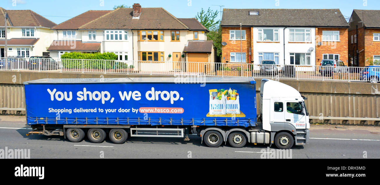 Houses close to A12 dual carriageway trunk road with heavy noisy hgv lorry traffic Stock Photo