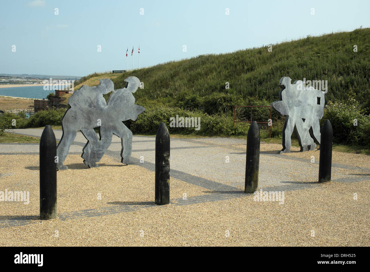 Metal figures of soldiers carrying ammunition at Newhaven Fort, East Sussex, UK.. Stock Photo