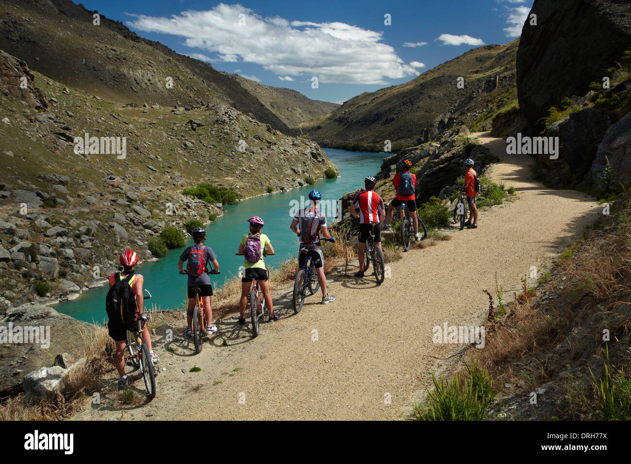 Mountain bikers and Lake Roxburgh on Roxburgh Cycle and Walking