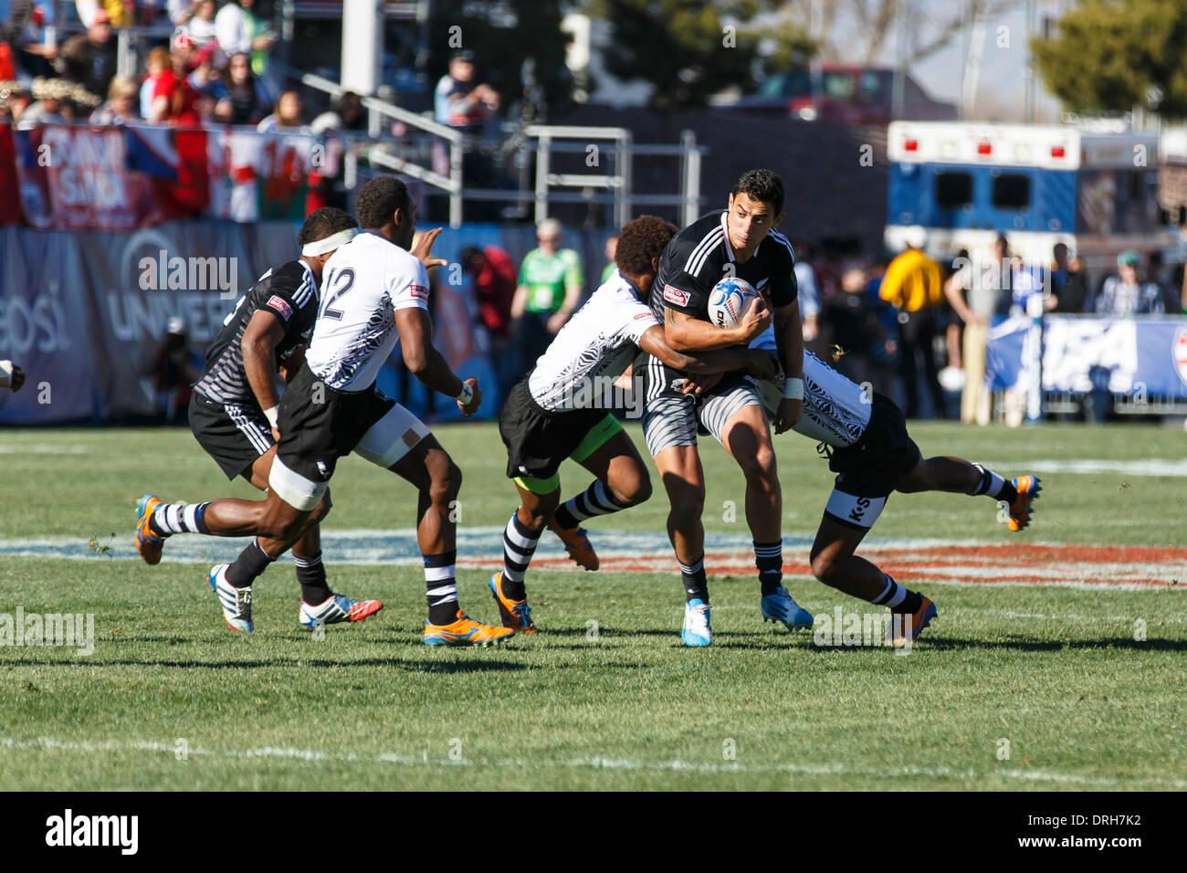 Las Vegas, Nevada, USA. 25th Jan, 2014. New Zealand vs Fiji in Pool B match. Bryce Heem #7 of New Zealand double tackled by Fiji defenders. Final score: New Zealand 12 -Fiji 7 at the USA round of the HSBC Sevens World Series in Sam Boyd Arena, Las Vegas, Nevada. Credit:  Action Plus Sports/Alamy Live News Stock Photo