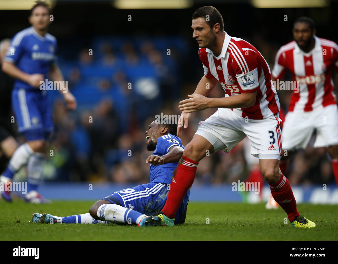 London, UK. 26th Jan, 2014. Samuel Eto'o(L) of Chelsea is stepped on the heel by Erik Pieters of Stoke City during FA Cup Fourth Round match between Chelsea and Stoke City at Stamford Bridge Stadium in London, Britain on Jan. 26, 2014. Chelsea won 1-0. Credit:  Wang Lili/Xinhua/Alamy Live News Stock Photo