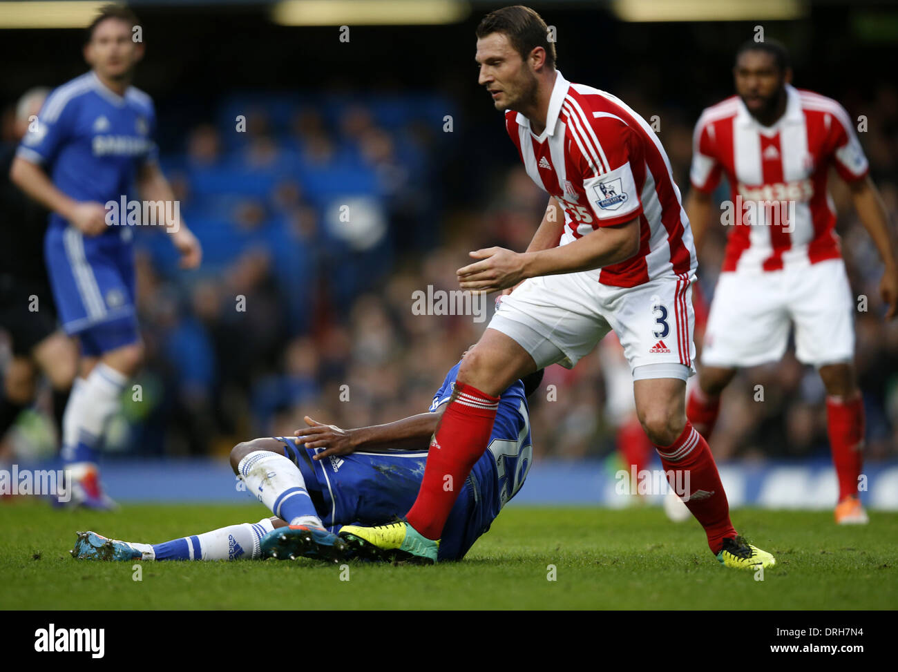 London, UK. 26th Jan, 2014. Samuel Eto'o(L) of Chelsea is stepped on the heel by Erik Pieters of Stoke City during FA Cup Fourth Round match at Stamford Bridge Stadium in London, Britain on Jan. 26, 2014. Chelsea won 1-0. Credit:  Wang Lili/Xinhua/Alamy Live News Stock Photo