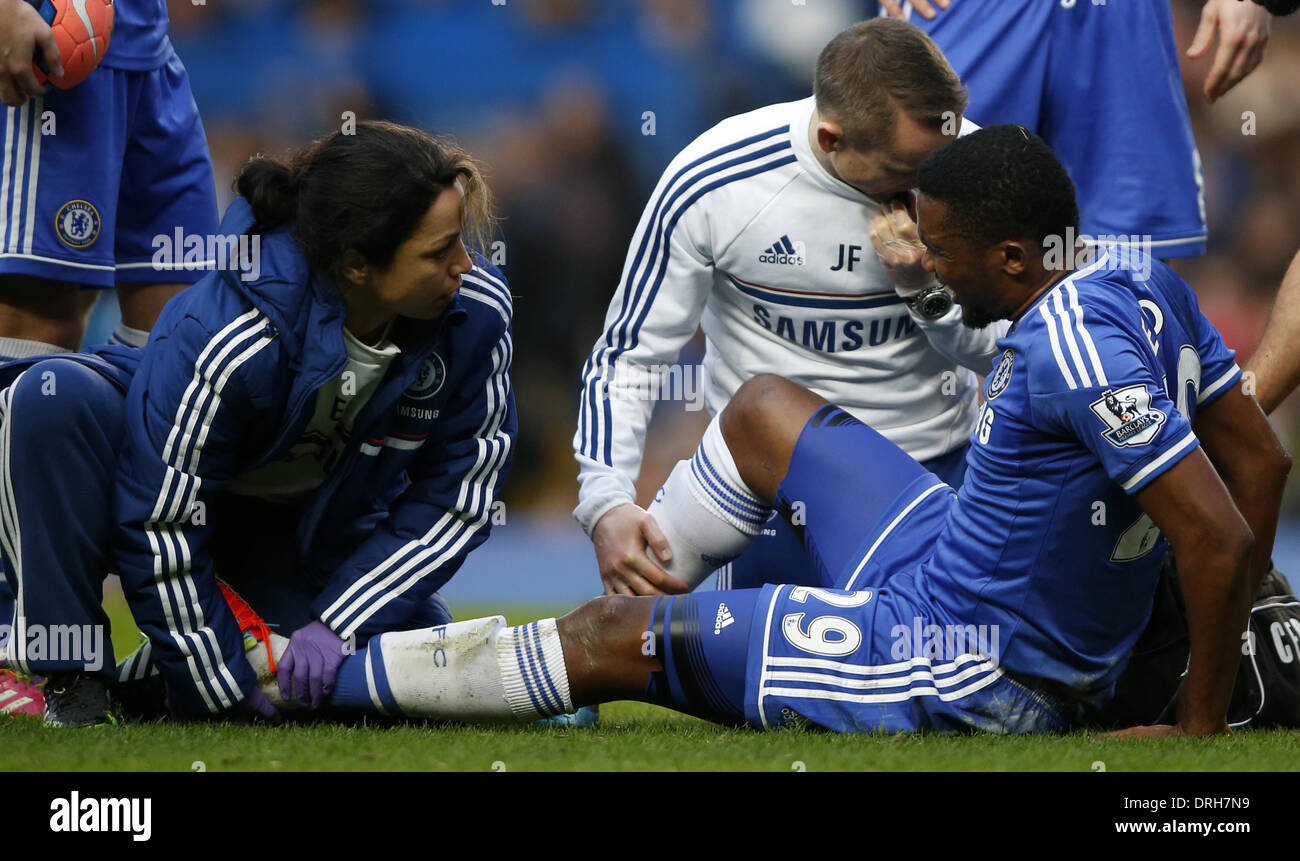 London, UK. 26th Jan, 2014. Samuel Eto'o(R) of Chelsea receives medical treatment after being stepped on the heel by Erik Pieters of Stoke City during FA Cup Fourth Round match at Stamford Bridge Stadium in London, Britain on Jan. 26, 2014. Chelsea won 1-0. Credit:  Wang Lili/Xinhua/Alamy Live News Stock Photo