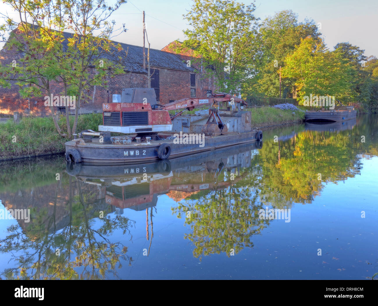 MWB2 riveted steel crane barge at work on the Bridgewater Canal, near Grappenhall, Cheshire, UK, WA4 Stock Photo