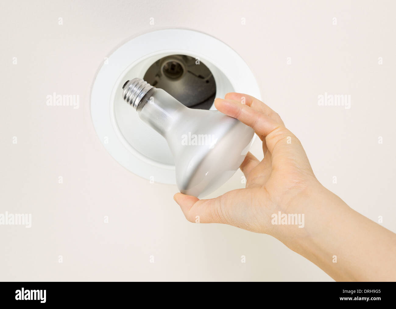Photo Of Burned Out Flood Light Bulb Being Held By Female Hand