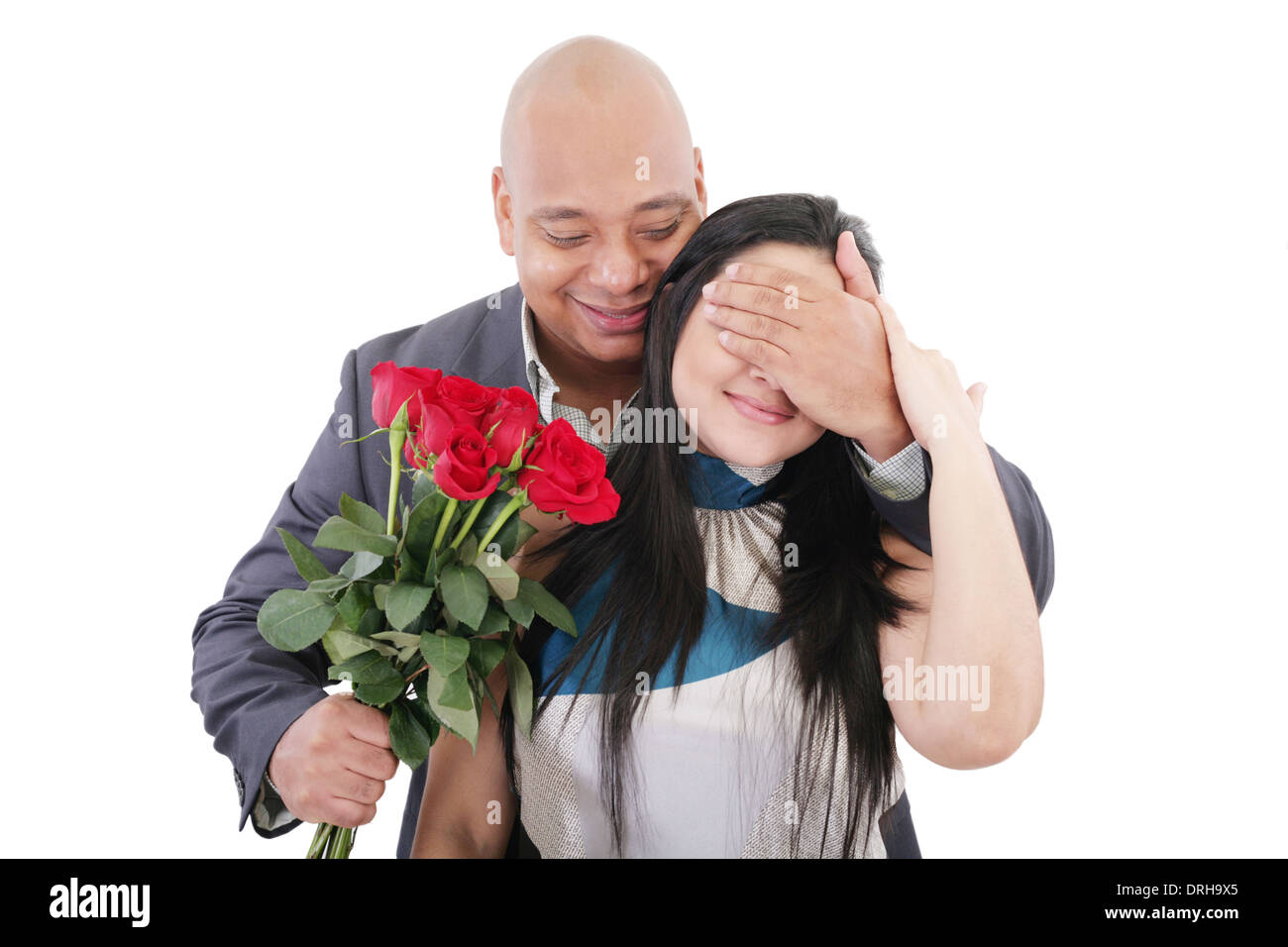 Offeing Roses Man offering a bouquet of red roses to a woman Stock Photo - Alamy