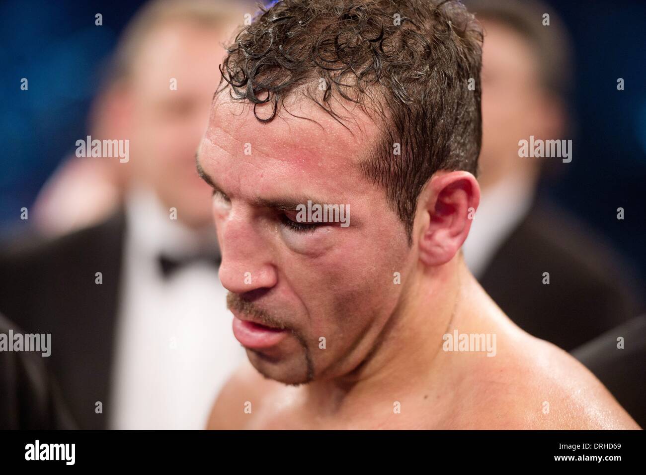 Stuttgart, Germany. 26th Jan, 2014. German boxer Firat Arslan reacts after loosing against Marco Huck in their World boxing Organization (WBO) Cruiserweight Championship match at Schleyer Hall in Stuttgart, Germany, 26 January 2014. Firat Arslan lost by technical k.o. in the sixth round. Photo: SEBASTIAN KAHNERT/dpa/Alamy Live News Stock Photo